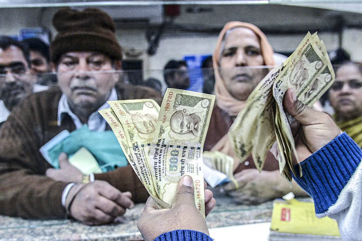 An Indian bank teller counts invalidated 500-rupee notes that are being exchanged for new notes in Amritsar, India, on Nov. 19, 2016. (NARINDER NANU/AFP/Getty Images)