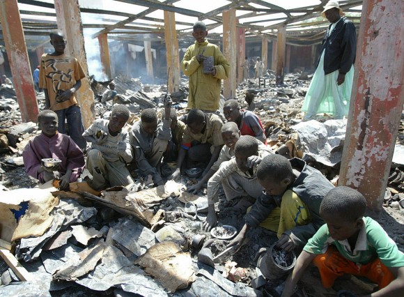 Children search for melted aluminium among ashes of a burnt central market during fighting between the Chadian army and insurgents on Feb. 9, 2008, in N'Djamena, Chad. Scrap aluminum is often used in Africa to make cooking pots, which release lead and other toxins into food, according to a study published in the February 2017 issue of the journal Science of the Total Environment. (Kambou Sia/AFP/Getty Images)