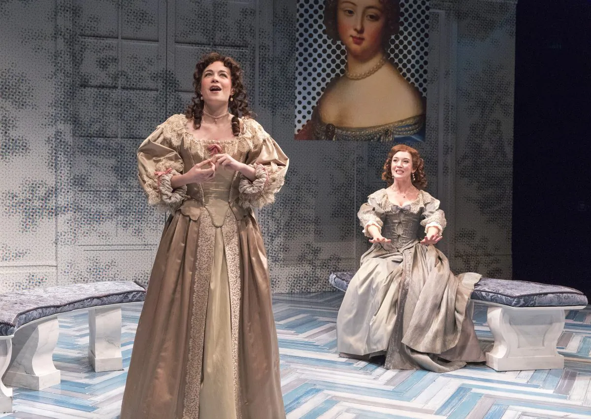 (L–R) Clarice (Ismenia Mendes) and Lucrece (Amelia Pedlow) have very different ideas about the stories suitor Dorante tells, in “The Liar.” (Richard Termine)