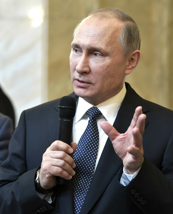 Russian President Vladimir Putin speaks to students at the Moscow State University in Moscow, Russia on Jan. 25, 2017. A day ahead of President Donald Trump's weekend call with Putin, the fight within the Republican Party over the direction of U.S. policy toward Moscow intensified. (Alexei Nikolsky/Sputnik, Kremlin Pool Photo via AP, File)