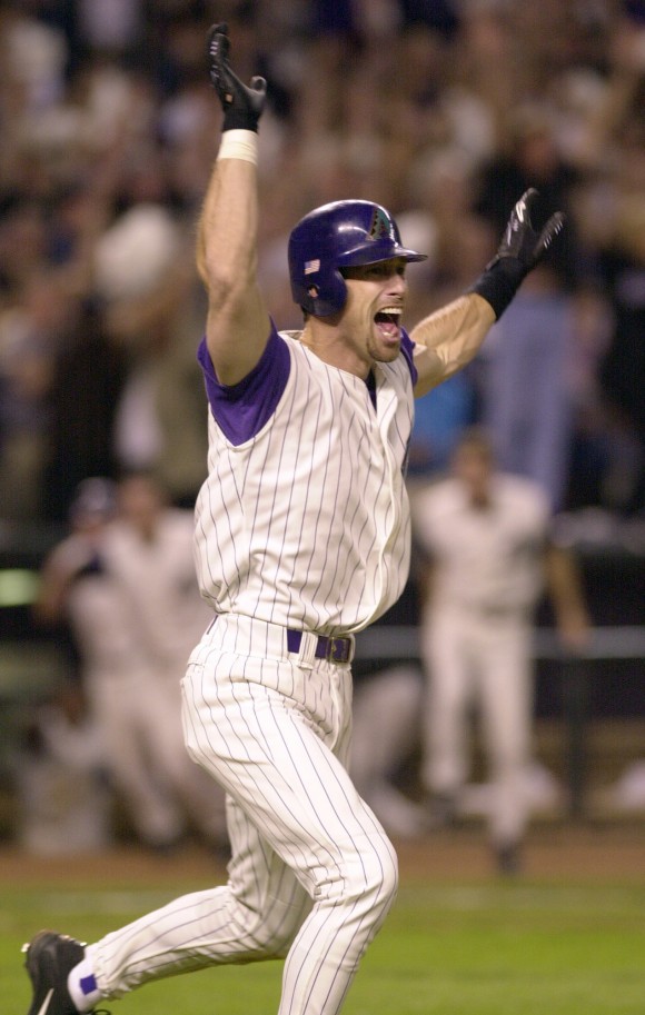 Arizona Diamondbacks' Luis Gonzalez celebrates driving in the winning run in the ninth inning of Game 7 of the baseball World Series against the New York Yankees in Phoenix on Nov. 4, 2001. Less than two months after the terrorist attacks knocked down the World Trade Center towers, the New York Yankees had the country behind them for once during the 2001 World Series as emotional renditions of