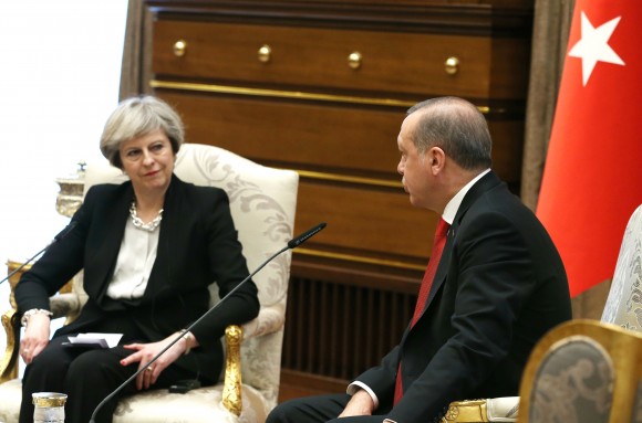 Turkey's President Recep Tayyip Erdogan, right, talks with British Prime Minister Theresa May, during their meeting at the Presidential Palace in Ankara, Turkey, Saturday, Jan. 28, 2017. May on Saturday met with Erdogan, a day after a friendly meeting in Washington with U.S. President Donald Trump. (Presidential Press Service, Pool via AP)
