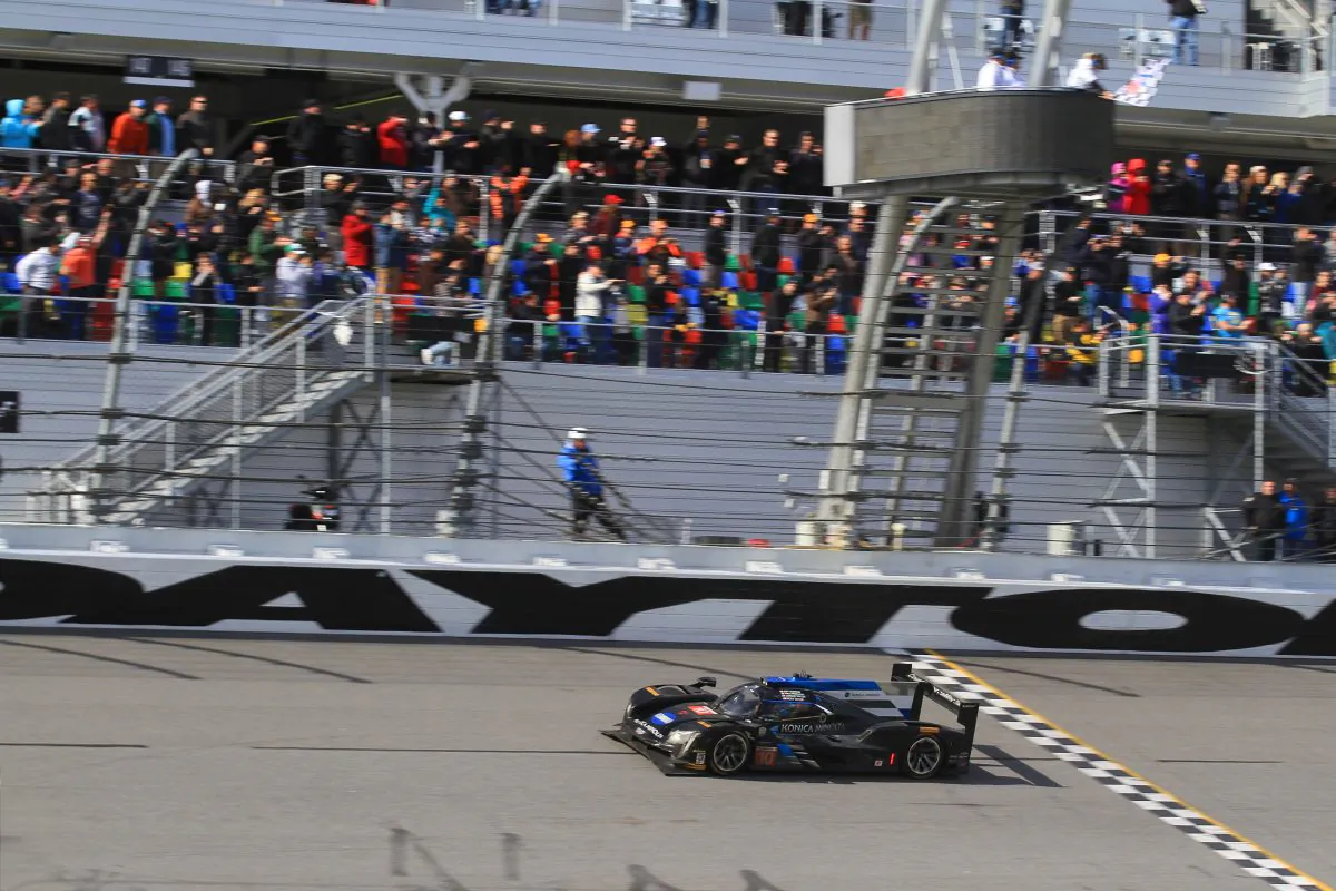 Ricky Taylor crosses the finish line in the #10 Wayne Taylor Racing Cadillac DPi after 24 hard hours of racing to win the 2017 IMSA WeatherTech Rolex 24 at Daytona, Jan. 29, 2017. (Chris Jasurek/Epoch Times)