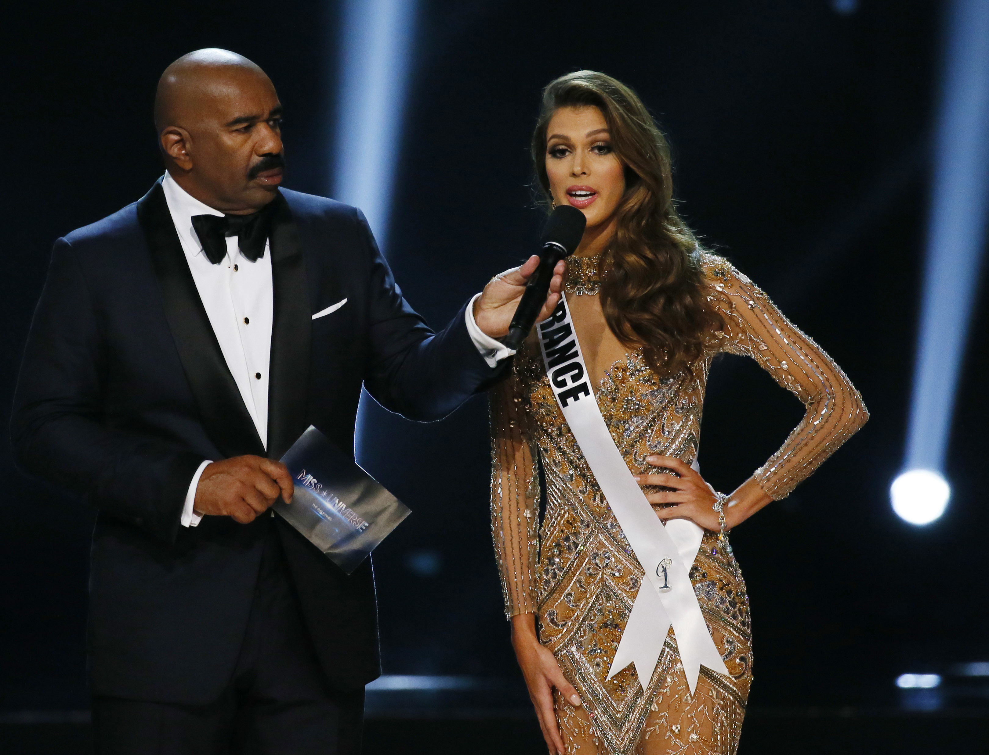 Miss France Iris Mittenaere expounds on her answer during the question-and-answer portion of the Miss Universe 2016 competition at the Mall of Asia in suburban Pasay city, south of Manila, Philippines on Jan. 30, 2017. (AP Photo/Bullit Marquez)