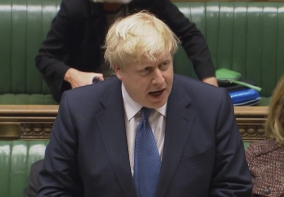 Foreign Secretary Boris Johnson makes a statement regarding US President Donald Trump's travel ban in the House of Commons, London on Jan. 30, 2017. British Foreign Secretary Boris Johnson says he has been assured by American officials that "all British passport holders remain welcome" in the United States, even if they are also nationals of seven countries temporarily barred by President Donald Trump. (PA via AP)