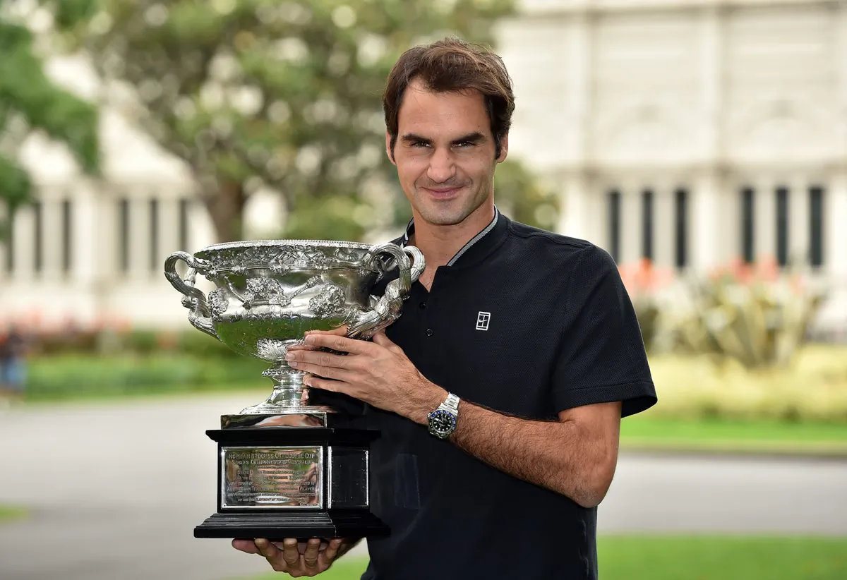 Roger Federer of Switzerland holds the championship trophy during a photo shoot the day after winning
the Australian Open men’s singles final for his 18th career Grand Slam in Melbourne on Jan 29. (Saeed Khan/AFP/Getty Images)