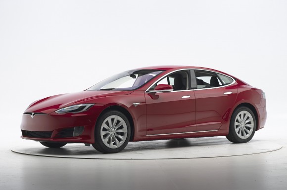 This Sept. 7, 2016, photo provided by the Insurance Institute for Highway Safety shows a Tesla Model S before crash safety testing. The car earned good ratings in four of the institute's five tests, but fell short of getting the highest safety rating in the newest crash tests administered by the insurance industry. (Matt Daly/Insurance Institute for Highway Safety via AP)