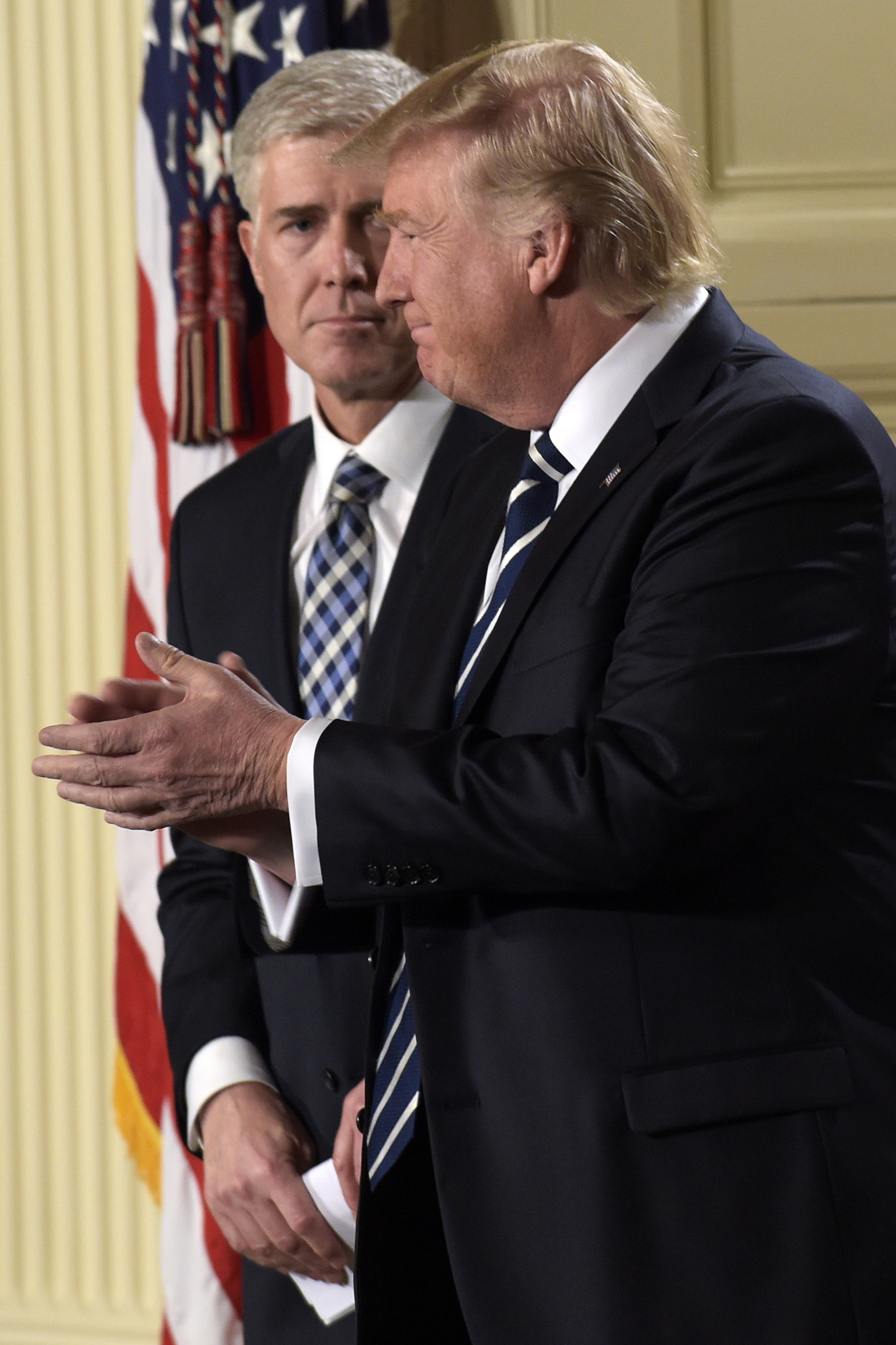President Donald Trump claps after announcing 10th U.S. Circuit Court of Appeals Judge Neil Gorsuch as his choice for Supreme Court Justice during a televised address from the East Room of the White House in Washington on Jan. 31, 2017. (AP Photo/Susan Walsh)