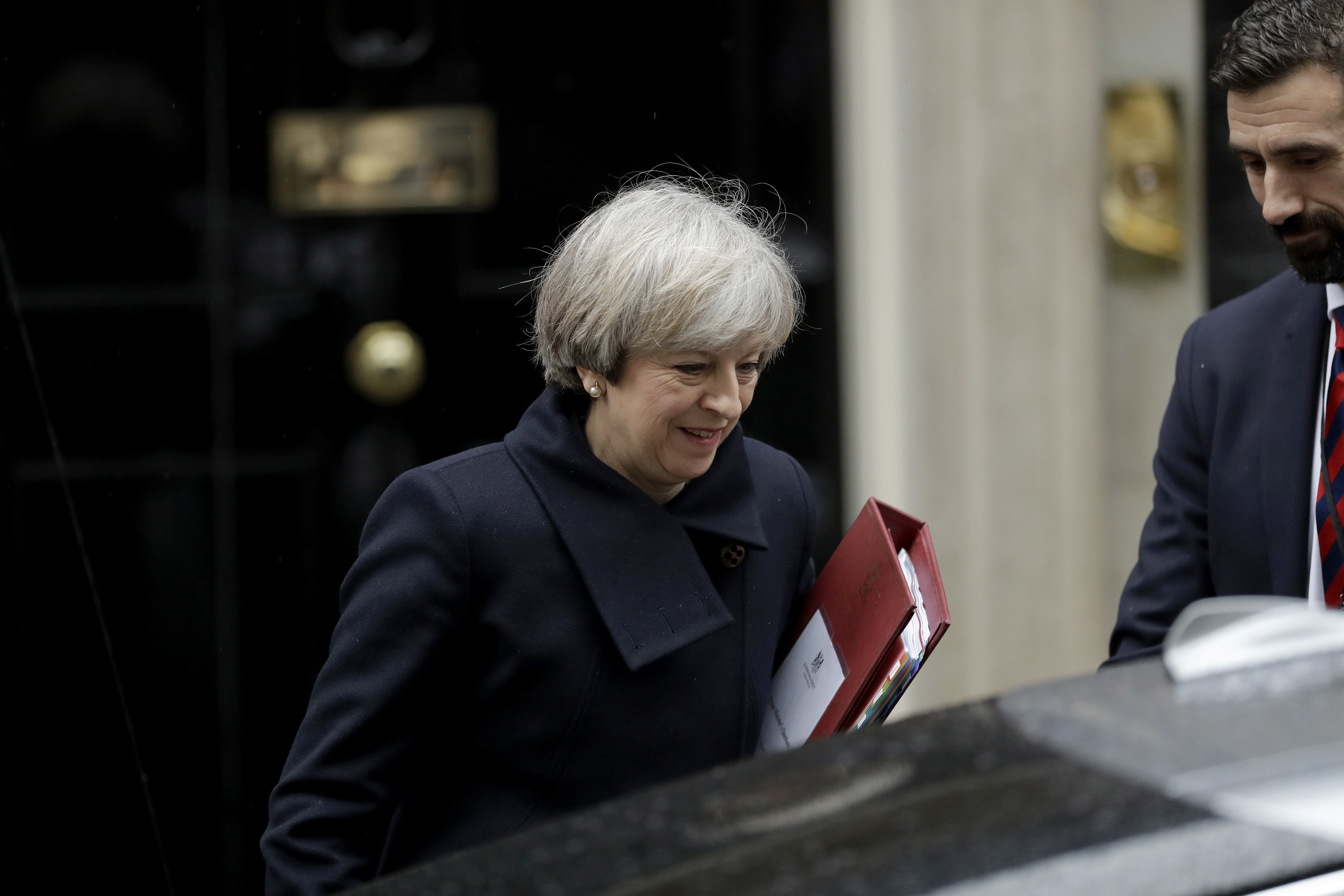 British Prime Minister Theresa May gets in a car as she leaves 10 Downing Street in London, to attend Prime Minister's Questions at the Houses of Parliament on Feb. 1, 2017. (AP Photo/Matt Dunham)