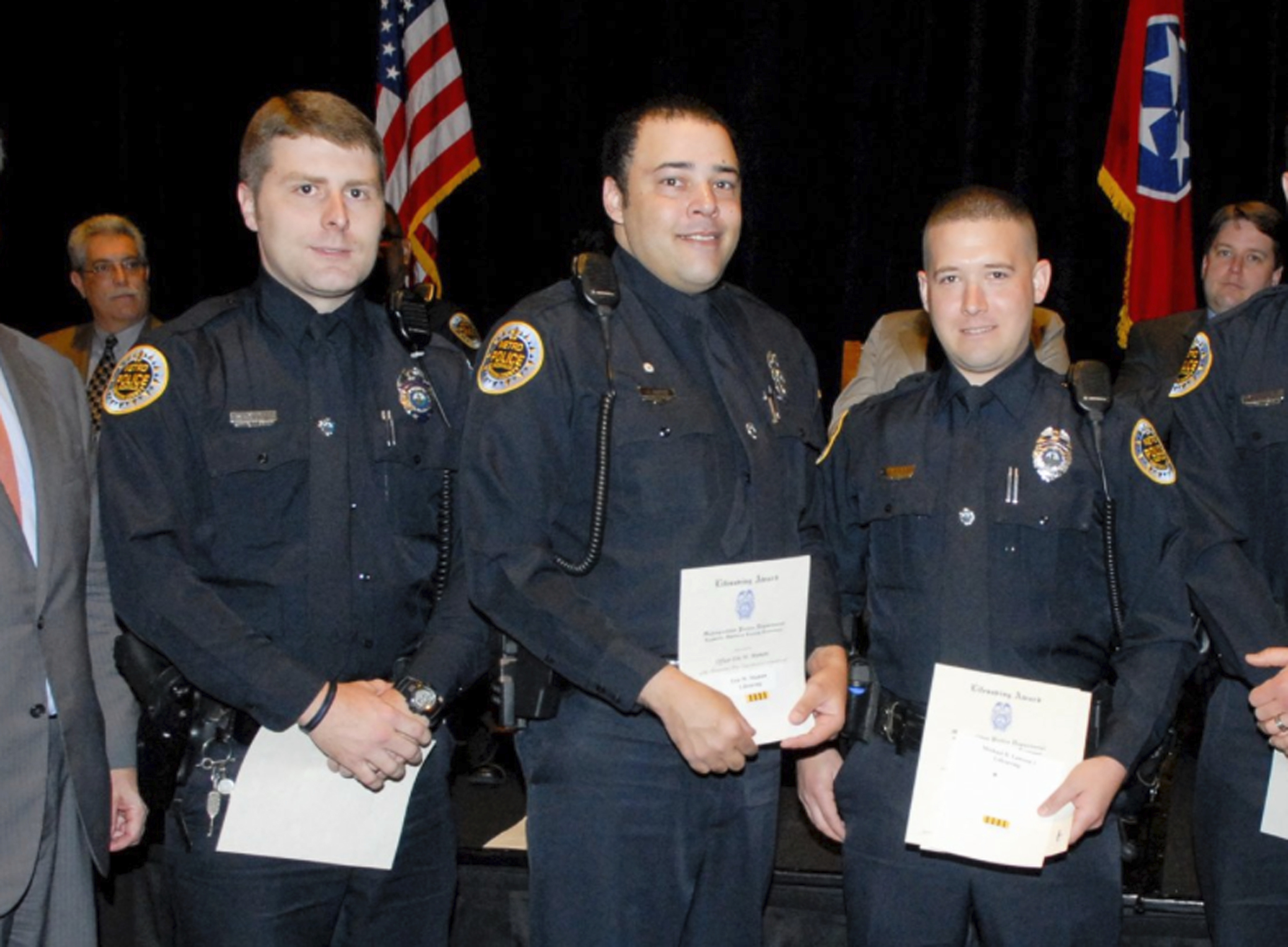 Metro Police Department shows Officer Eric Mumaw (C) receiving the department's Lifesaving Award. (Metro Nashville Police Department via AP)