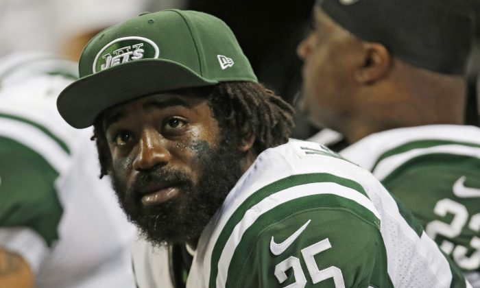 New York Jets running back Joe McKnight watches from the bench during the fourth quarter of an NFL football game against the St. Louis Rams in St. Louis on Nov. 18, 2012. (AP Photo/Tom Gannam)
