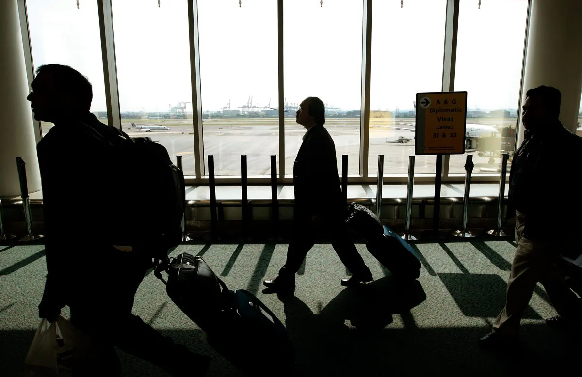 Travels walk toward the passport control line upon arriving at Newark International Airport in New Jersey in this file photo. (Chris Hondros/Getty Images)
