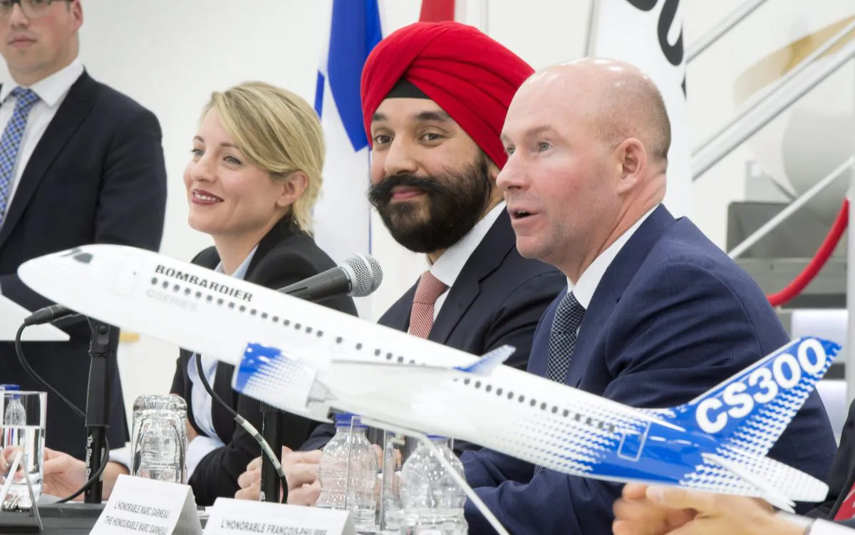 Bombardier president and CEO Alain Bellemare ® responds to a question as Heritage Minister Melanie Joly (L) and Innovation Minister Navdeep Bains watch on Feb. 7 in Montreal. (The Canadian Press/Paul Chiasson)