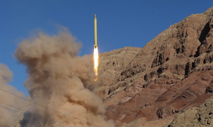 A long-range Qadr ballistic missile is launched in the Alborz mountain range in northern Iran on March 9, 2016. (Mahmood Hosseini/AFP/Getty Images)