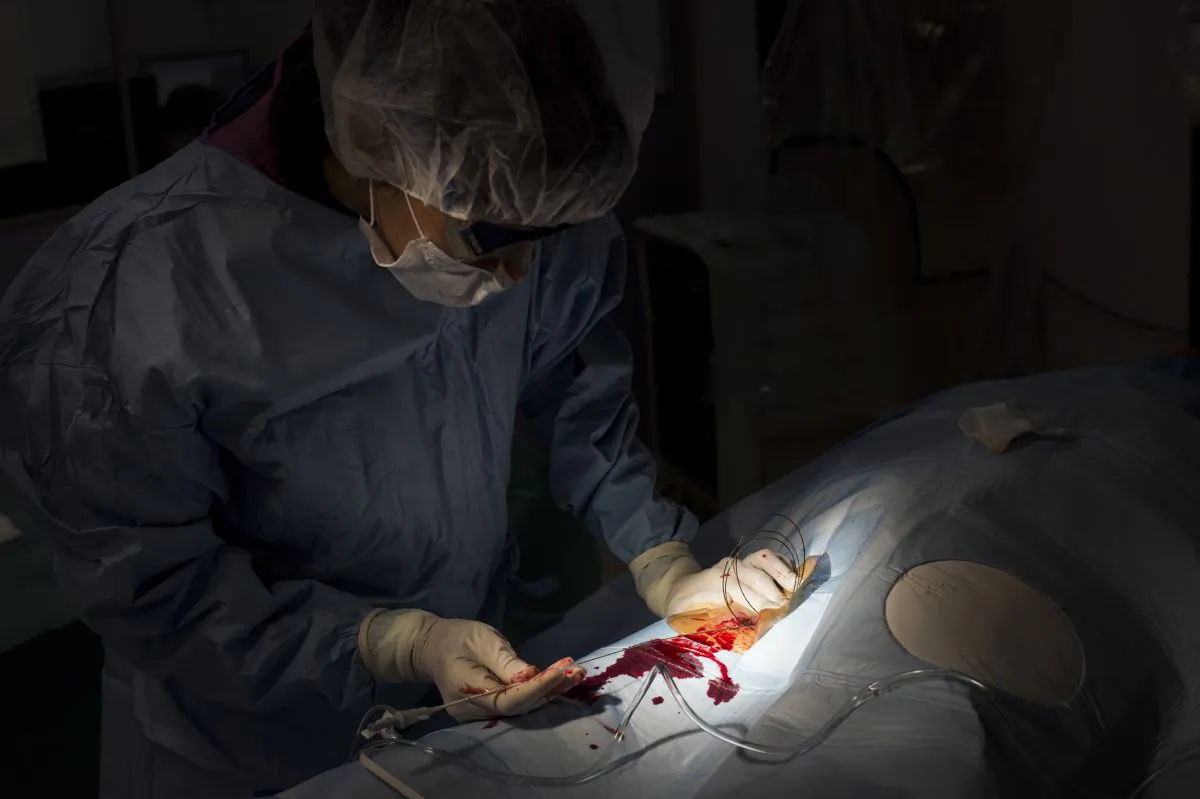 A doctor operates a patient in this file photo. (FRED DUFOUR/AFP/Getty Images)