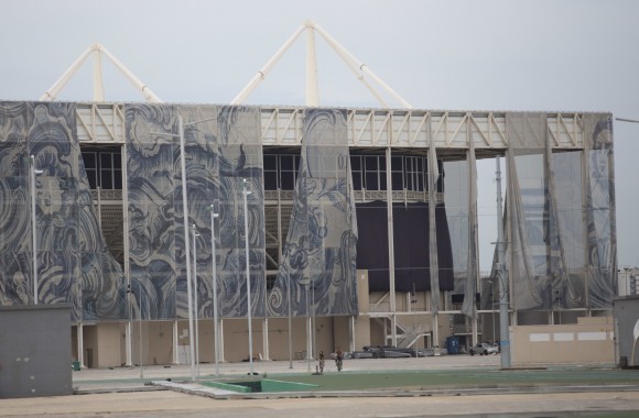 This Feb. 4, 2017 photo shows translucent tapestries created by Brazilian artist Adriana Varejao, falling from the exterior of Olympic Aquatic stadium inside Olympic Park in Rio de Janeiro, Brazil. (AP Photo/Silvia Izquierdo)