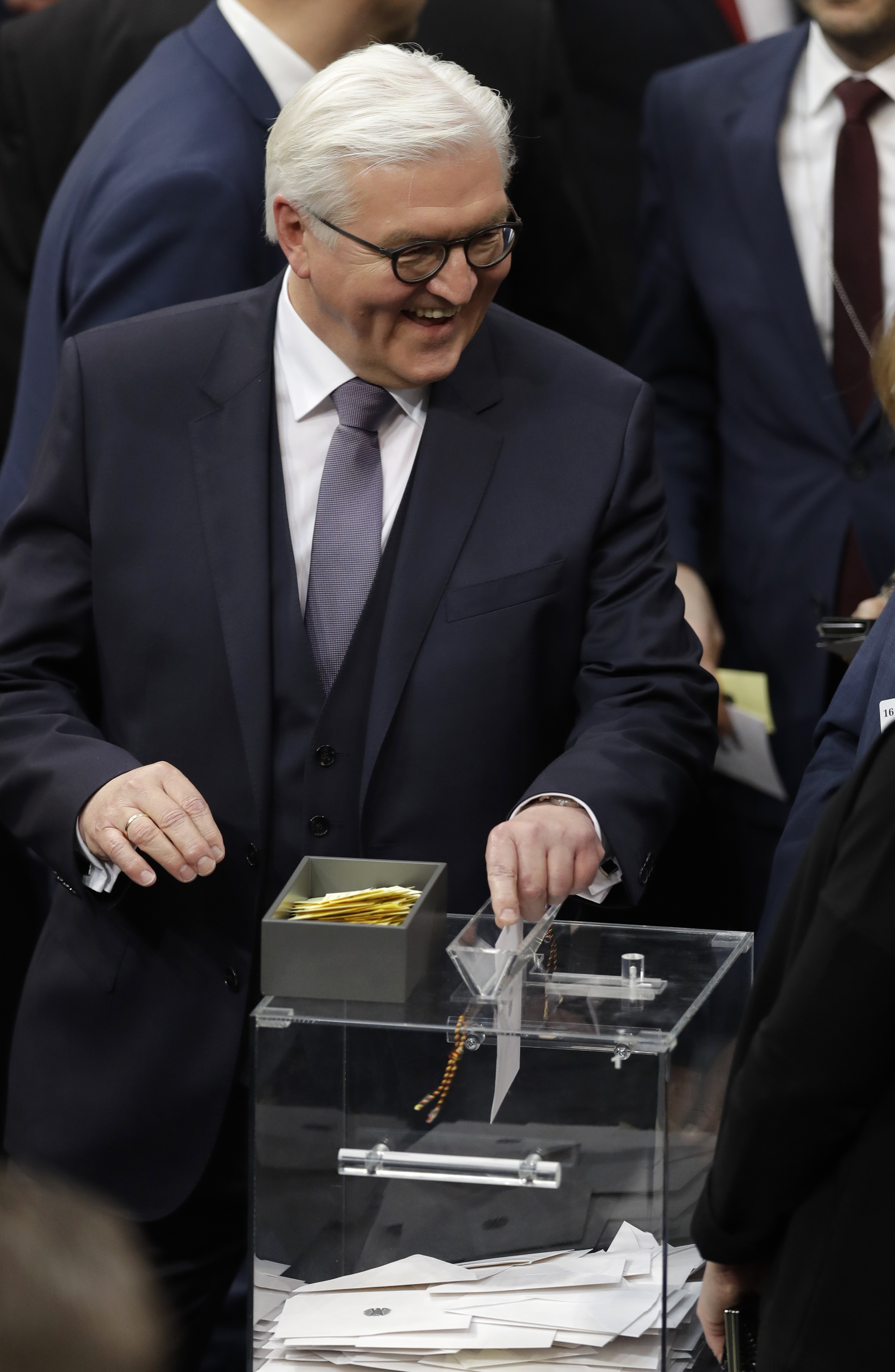 German presidential candidate Frank-Walter Steinmeier casts his ballot when a German parliamentary assembly came together to elect the country's new president in Berlin, Germany on Feb. 12, 2017. (AP Photo/Michael Sohn)
