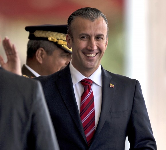 Venezuela's Vice President Tareck El Aissami, right, is saluted by Boilivarian Army officer upon his arrival for a military parade at Fort Tiuna in Caracas, Venezuela on Feb. 1, 2017. (AP Photo/Fernando Llano)
