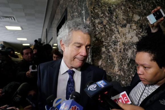Pedro Hernandez's defense lawyer Harvey Fisbein (C) makes his way past journalists at a court in New York on January 30, 2015 at the lunch break of his client's trial in accusation of kidnapping and killing six-year-old Etan Patz in one of America's most famous missing child cases. Hernandez, 53, is accused of luring Etan Patz into the basement of the grocery store where he worked, before killing and dumping his body out with the trash on May 25, 1979. (JEWEL SAMAD/AFP/Getty Images)