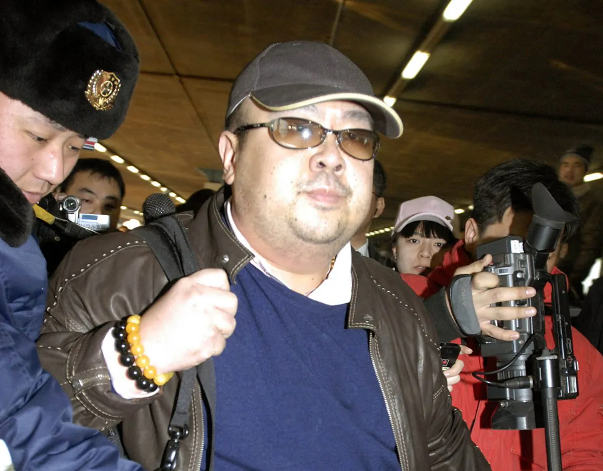 In this file photo, a man believed to be Kim Jong Nam, eldest son of then North Korean leader Kim Jong Il, is surrounded by the media upon arrival from Macau at Beijing airport in Beijing. (Kyodo News via AP)