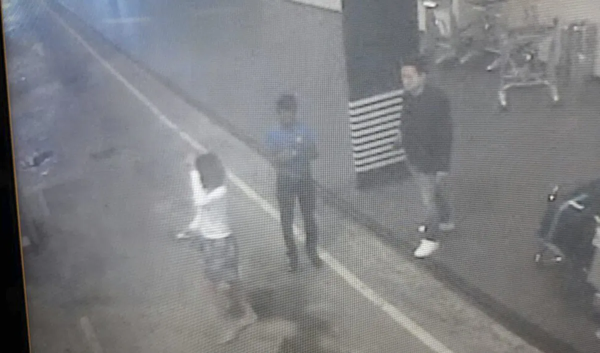 This image provided by Star TV on Wednesday, Feb. 15, 2017, of closed circuit television footage from Monday, Feb 13, 2017, shows a woman (L) at Kuala Lumpur International Airport in Sepang, Malaysia, who police say was arrested Wednesday in connection with the death of Kim Jong Nam, the half brother of North Korean leader Kim Jong Un. (Star TV via AP)