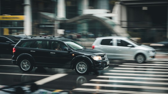 Black Suv Beside Grey Auv Crossing the Pedestrian Line during Daytime (File Photo)