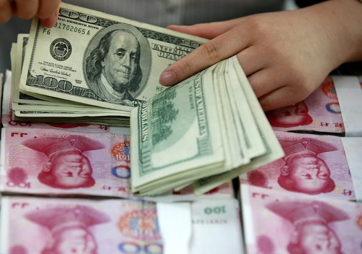 The duality conundrum of the Chinese currency is intriguing but can be explained using the plunging elevator theory. (Epoch Times)