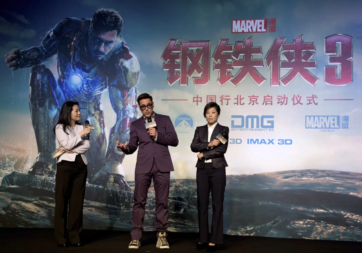 Robert Downey Jr, on stage
with DMG president Wu Bing (R) during the the world premiere event of "Iron Man 3," in Beijing on April 6, 2013. (AP Photo/Andy Wong)