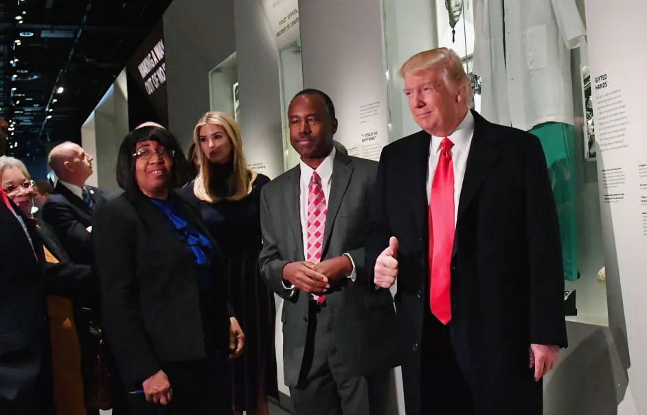 Former President Donald Trump and Housing and Urban Development nominee Ben Carson pose in front of the Ben Carson exhibit during a visit to the Smithsonian National Museum of African American History and Culture in Washington on Feb. 21, 2017. (Kevin Dietsch - Pool/Getty Images)
