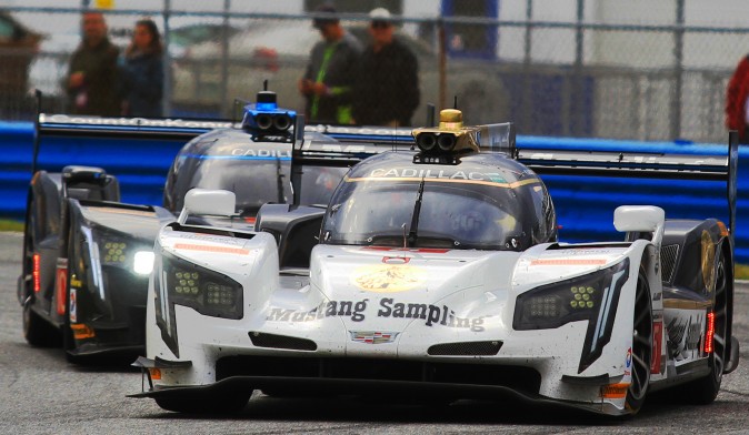The #5 Mustang Sampling Cadillac DPi V.R battled the #10 Wayne Taylor Racing Cadillac DPi this tightly until Ricky Taylor pushed his way Felipe Albuquerque seven minutes from the finish to win the 2107 Rolex 24. (Chris Jasurek/Epoch Times)
