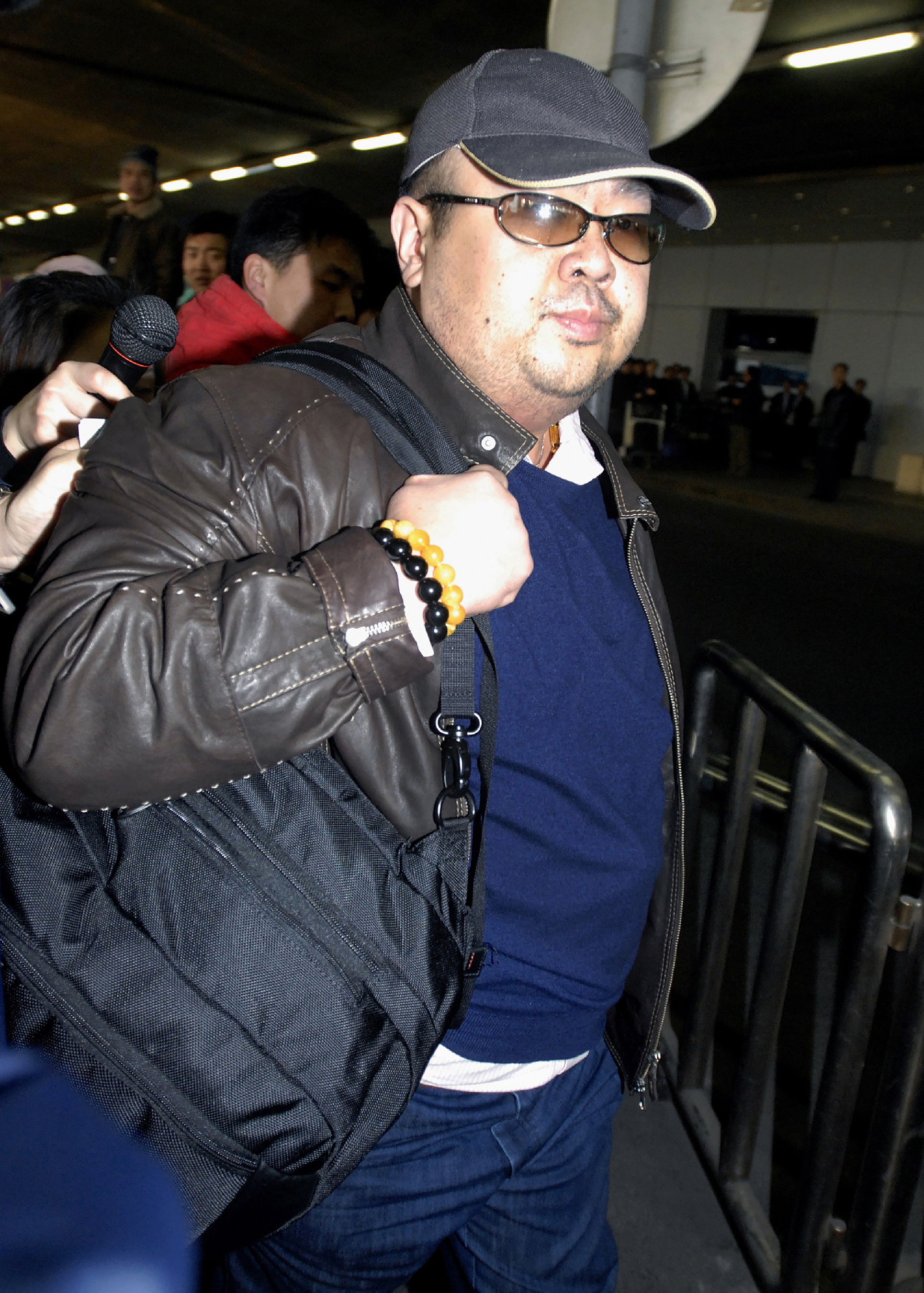 Former North Korean leader Kim Jong-Il's eldest son, Kim Jong-Nam, walking amongst journalists upon his arrival at Beijing's international airport on Feb. 11, 2007. (JIJI PRESS/AFP/Getty Images)