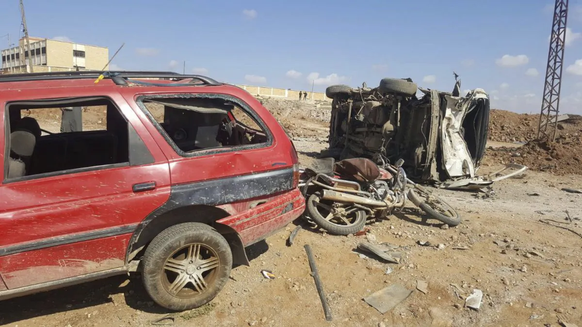 Damaged cars after a suicide attacker blew his small pick-up truck outside a security office in Sousian village, about 8 kilometers (5 miles) north of al-Bab on Feb. 24, 2017. (Thiqa News Agency, via AP)