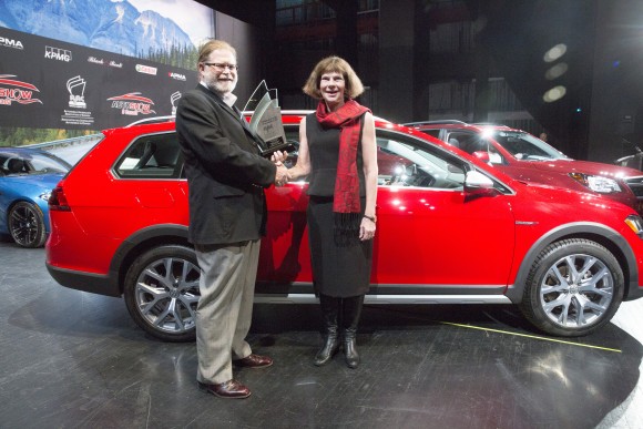 AJAC Director David Taylor, left, Maria Stenstrm, President and CEO, Volkswagen Canada Inc, right, after Volkswagen Golf Alltrack won the Canadian Car of the Year award in Toronto on February 16, 2017. (Photo By: Michelle Siu/AJAC)