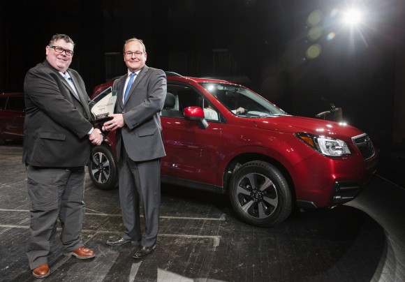 Gary Grant, AJAC Co-Chair (left) poses for a photo with Ted Lalka, Vice President, Product Management, Marketing & Customer Experience for Subaru (right) after the Subaru Forester wins the Canadian Utility Vehicle of the Year award in Toronto on February 16, 2017. (Photo By: Michelle Siu/AJAC)