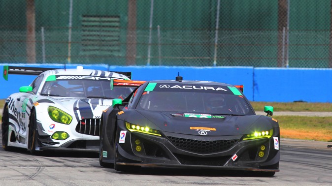 The #86 Acura NSX GT3 leads the #50 Riley-WeatherTech Mercedes AMG GT3 through Turn Ten. (Chris Jasurek/Epoch Times)