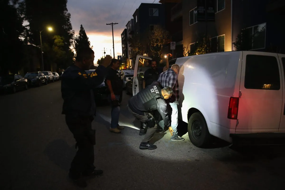 A suspected criminal alien is detained by Immigration and Customs Enforcement (ICE) agents in Los Angeles on Oct. 14, 2015. (John Moore/Getty Images)