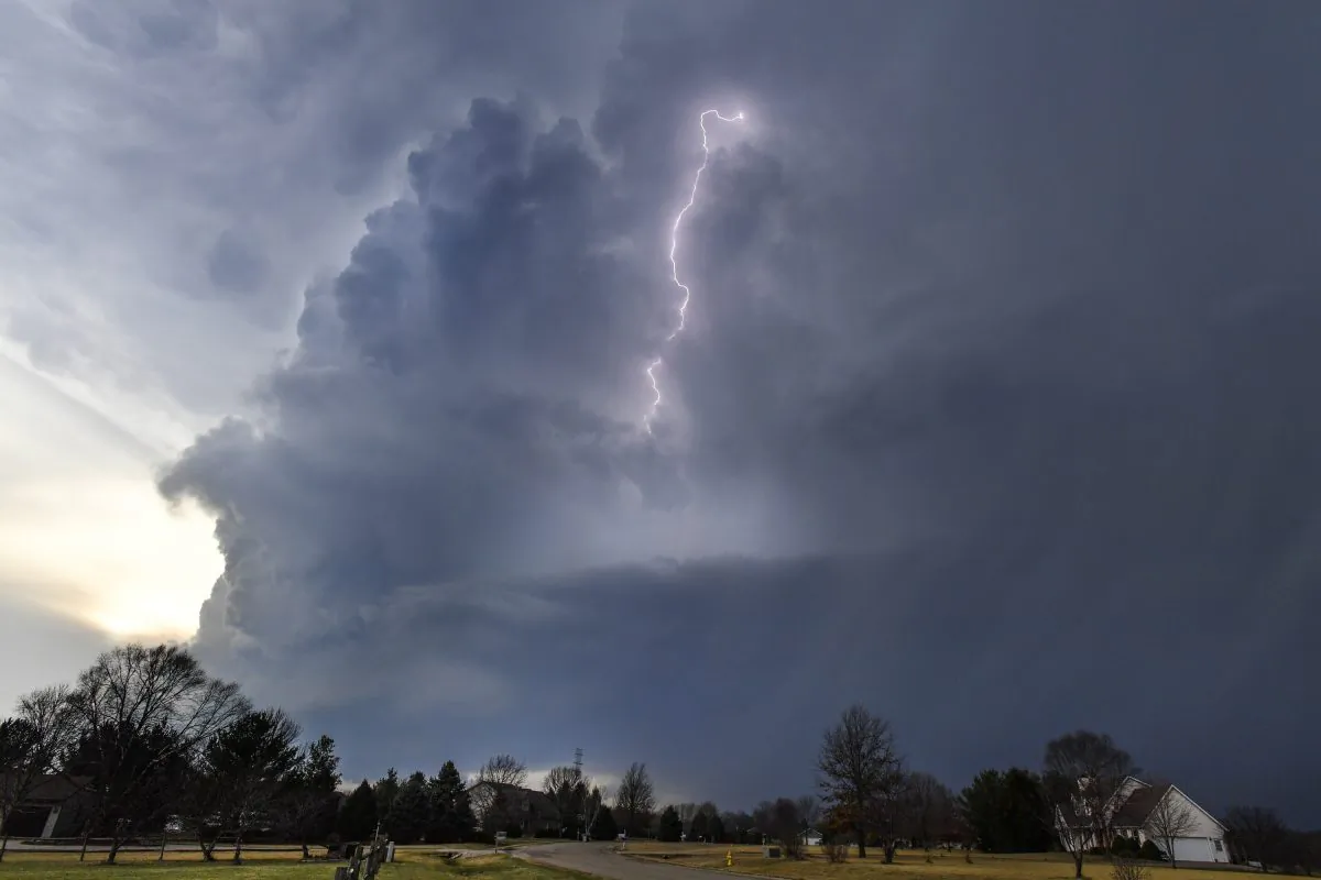 Lightning flashes in storm clouds over the village of Dunlap, Ill., on Feb. 28, 2017. (Ron Johnson/Journal Star via AP)