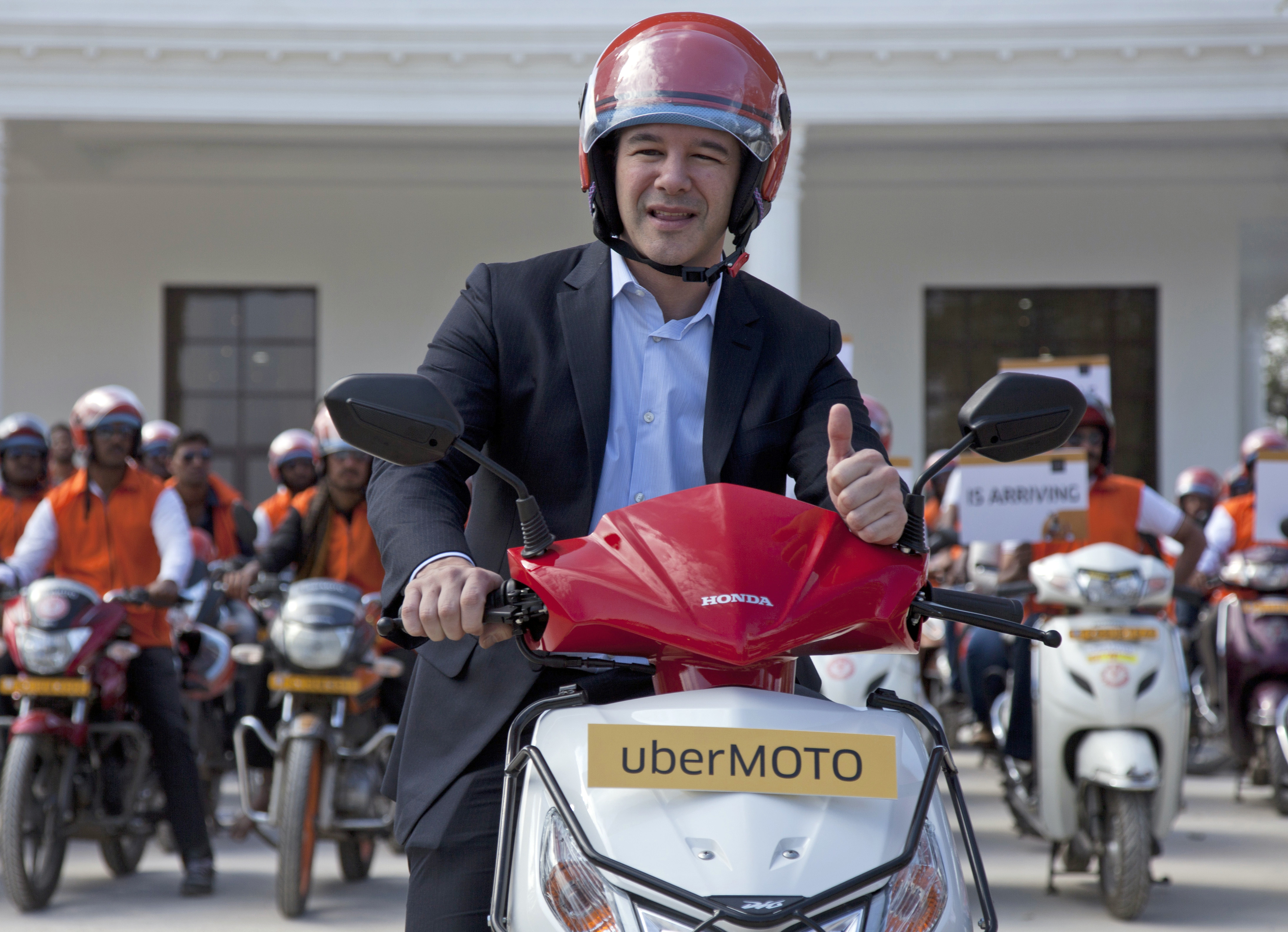 Uber CEO Travis Kalanick, during the launch of its bike-sharing product, uberMOTO, in Hyderabad, India on Dec. 13, 2016. (AP Photo/Mahesh Kumar A., File)