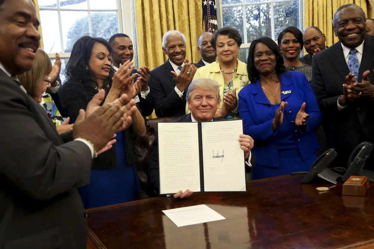 President Donald Trump signed the HBCU Executive Order to support Black Colleges and Universities in the Oval Office of the White House in Washington on Feb. 28, 2017. The executive order moves an initiative to assist the Historically Black Colleges and Universities from the Education Department back to the White House. (Aude Guerrucci-Pool/Getty Images)