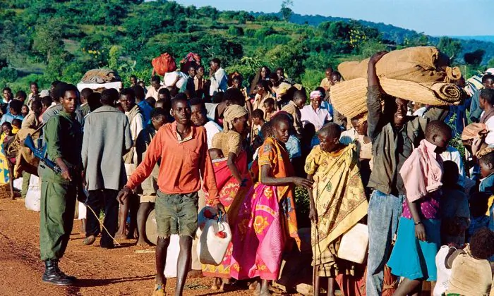 Refugees from Rwanda who have been forced to flee their homes by 12 days of ethnic carnage, are checked at Gasenyi border, about 144 miles northwest of Bujumbura, before being sent to a refugee camp on April 19, 1994. (PASCAL GUYOT/AFP/Getty Images)