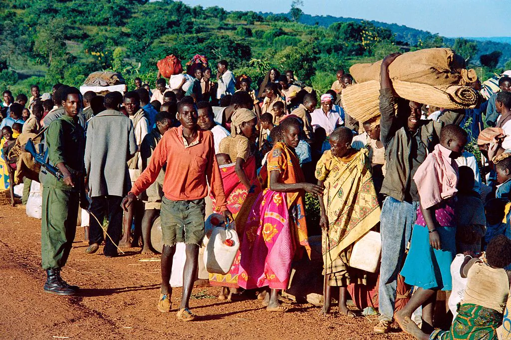 Refugees from Rwanda who have been forced to flee their homes by 12 days of ethnic carnage, are checked at Gasenyi border, about 144 miles northwest of Bujumbura, before being sent to a refugee camp on April 19, 1994. (PASCAL GUYOT/AFP/Getty Images)