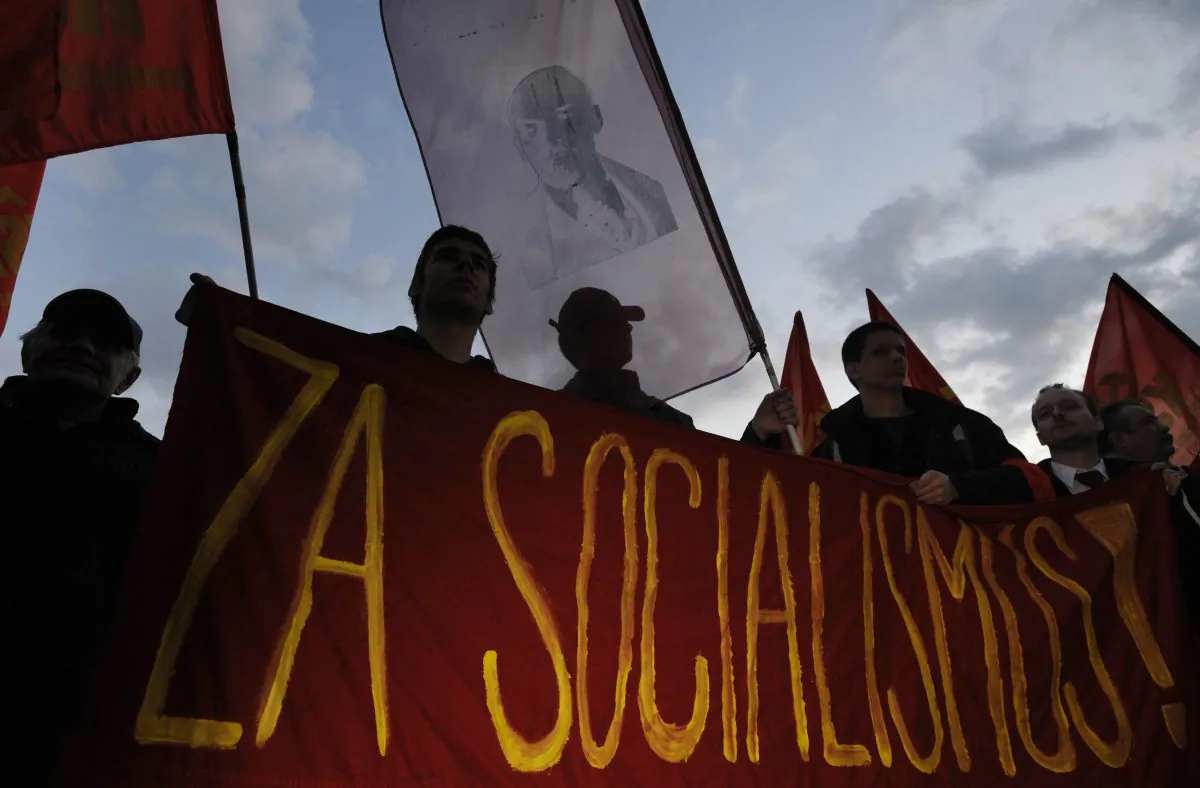 Pro-communist supporters hold flags and a portrait of Vladimir Lenin as they protest against the government in central Prague, Czech, in this file photo. (MichalI Cizek/AFP/Getty Images)