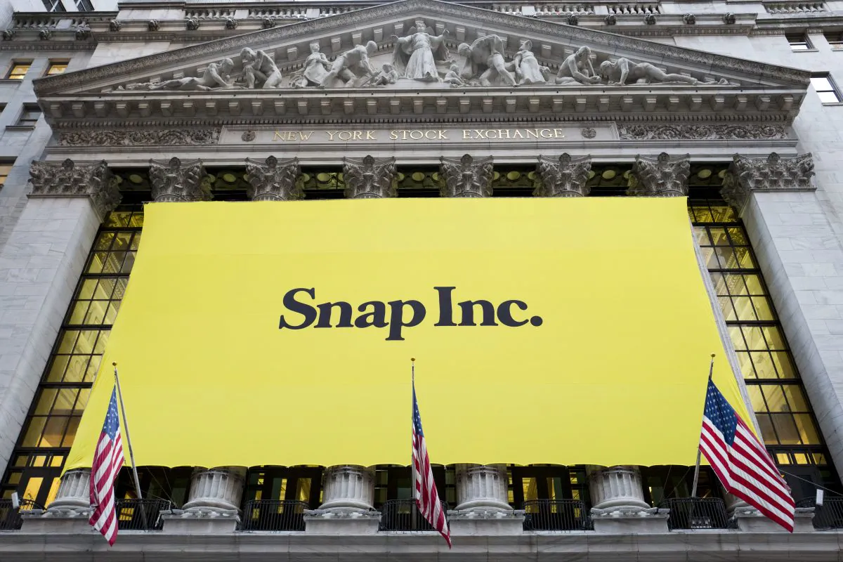 A banner for Snap Inc. hangs from the front of the New York Stock Exchange in New York on March 2, 2017. (AP Photo/Mark Lennihan)