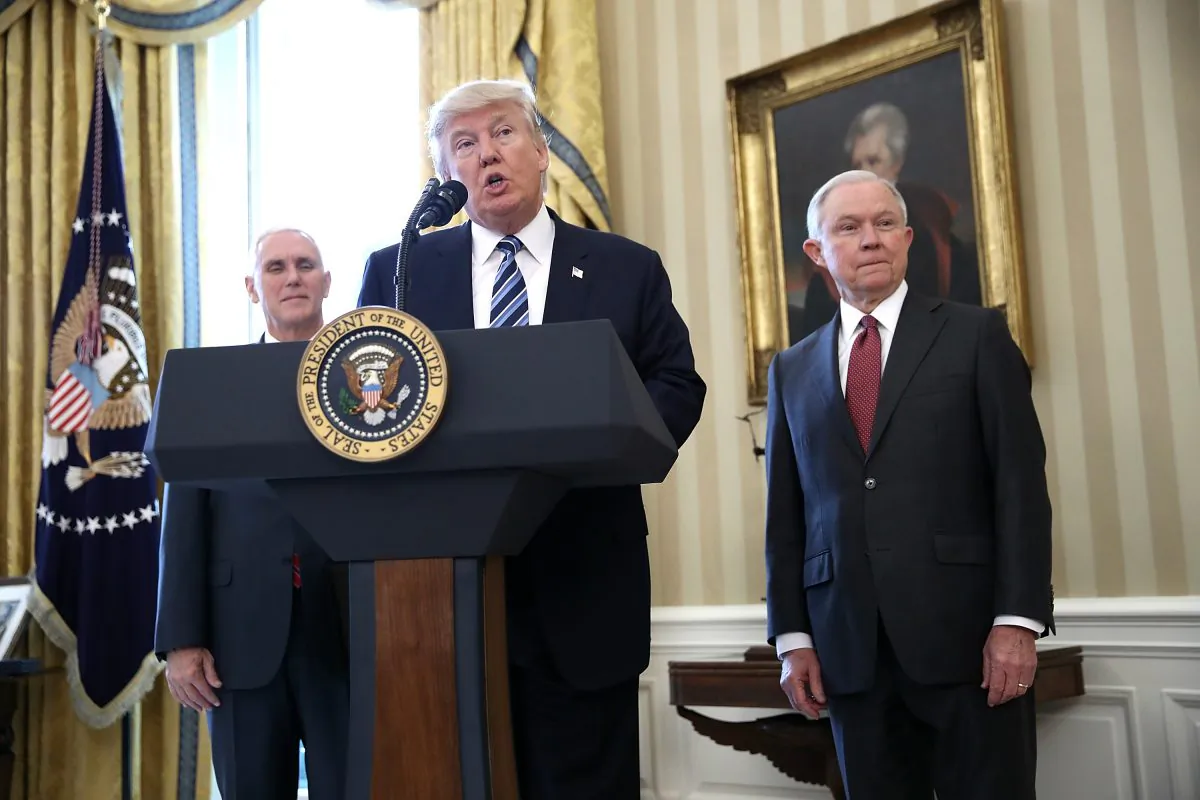 President Donald Trump (C) delivers remarks before the swearing in ceremony for Sen. Jeff Sessions (R) in the Oval Office of the White House in Washington, DC on Feb. 9, 2017. (Win McNamee/Getty Images)