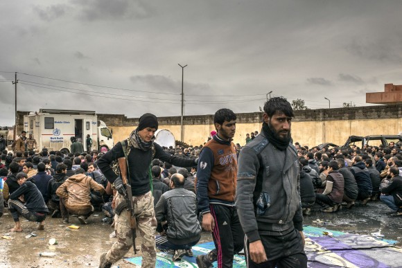 Iraqi men are detained as suspected ISIS fighters, March 4, 2017. Iraqi forces are advancing into west Mosul, part of the offensive to retake the city some two years after it fell to ISIS. (Martyn Aim/Getty Images)