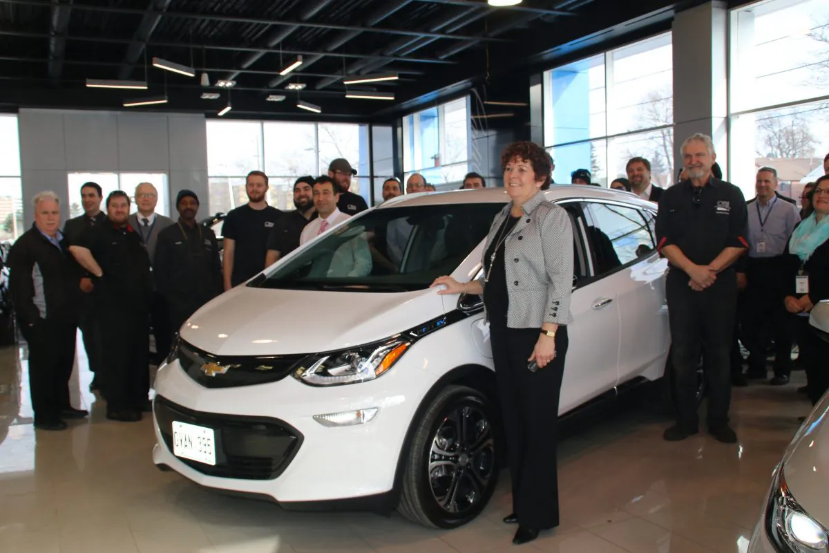 Samantha Mesrobian and her 2017 Chevrolet Bolt EV Premier and dealership personnel. (Courtesy of David Taylor)