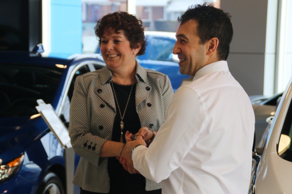 Samantha Mesrobian receiving the key fob from Sev Dervichian (Courtesy of David Taylor)