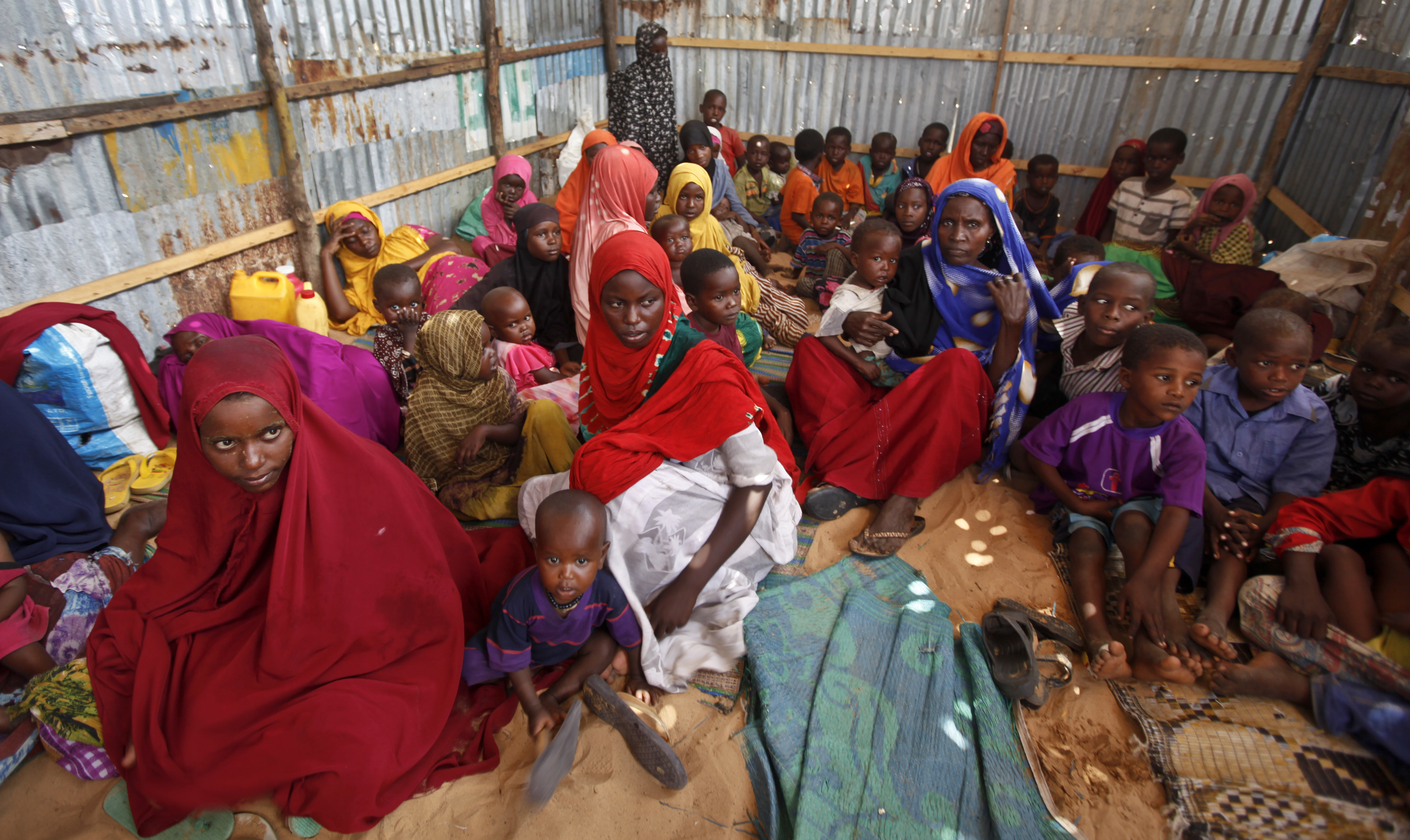 Displaced Somalis who fled the drought in southern Somalia sit in a camp in the capital Mogadishu, Somalia, in this file photo. (AP Photo/Farah Abdi Warsameh, File)