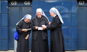 Caregiver Nuns Model Skillful Ways to Speak to Infirm Seniors