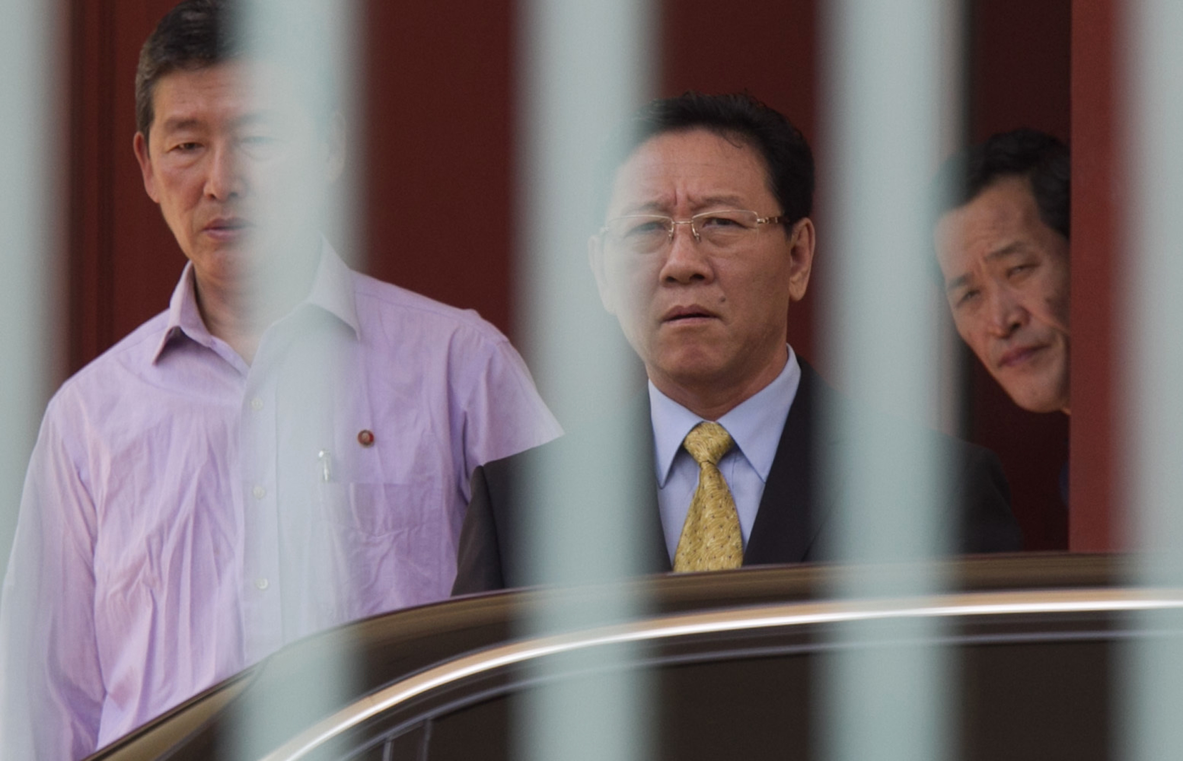 North Korean Ambassador to Malaysia Kang Chol (C) prepares to get on a car at the embassy in Kuala Lumpur, Malaysia on March 6, 2017. (AP Photo/Daniel Chan)